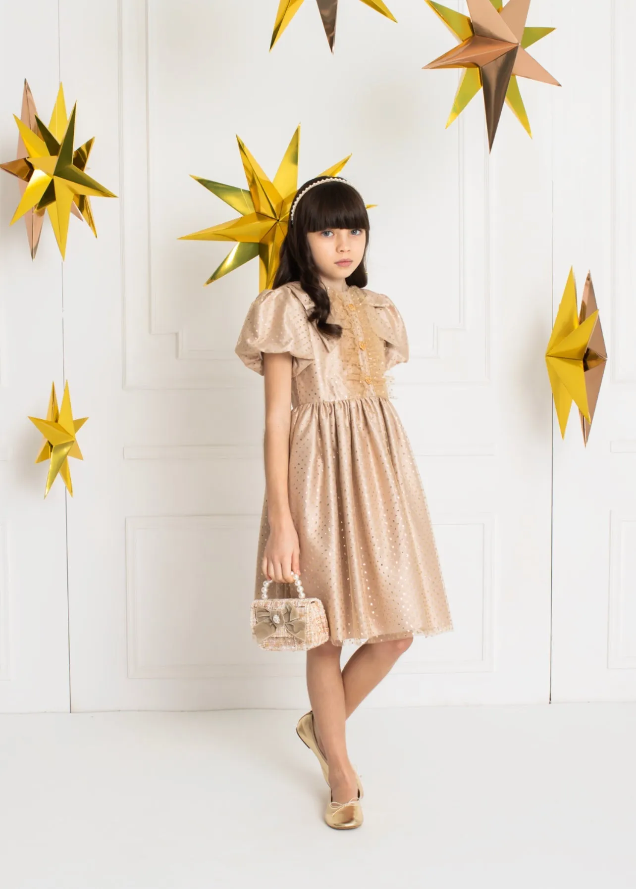 Beautiful Gold polkadot dress with ruffle and shoulder Bow details.
