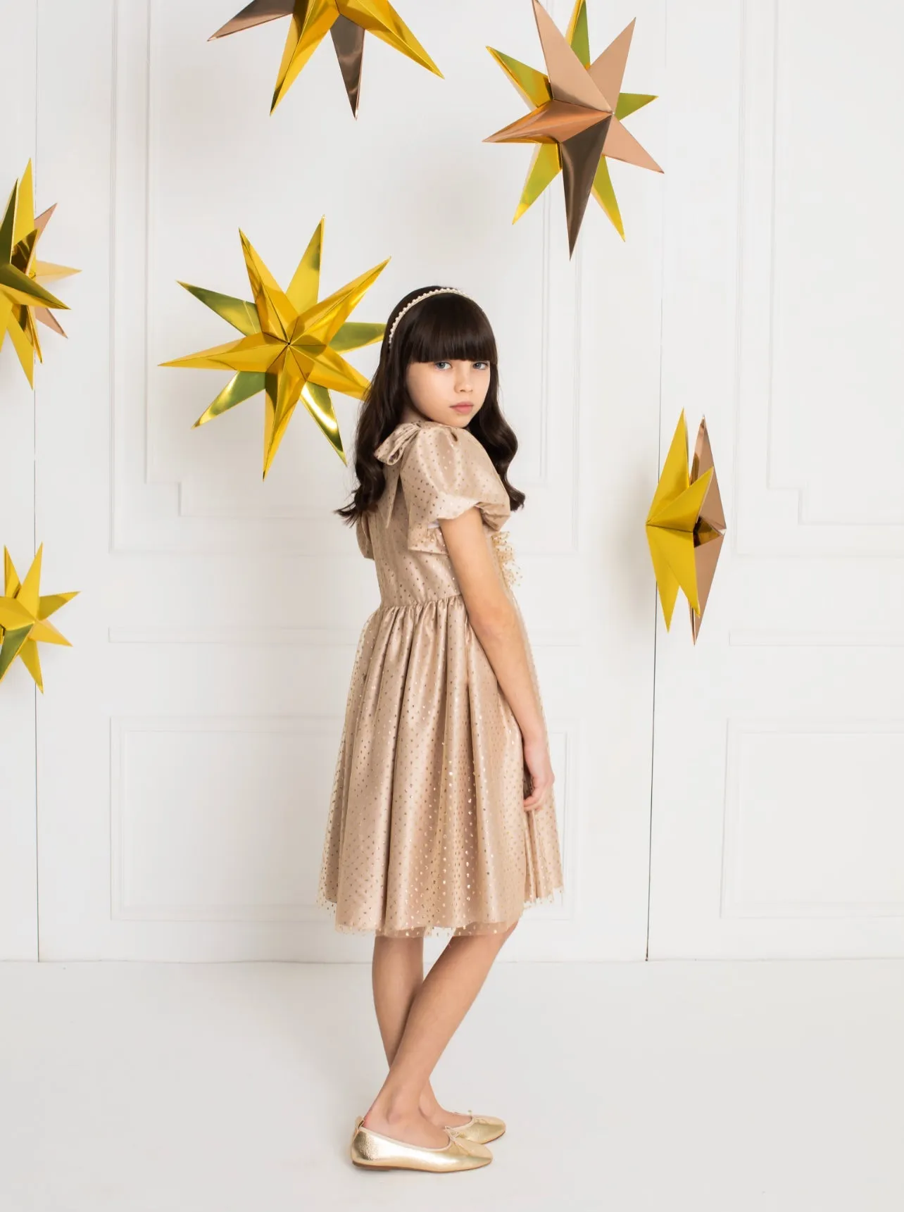 Beautiful Gold polkadot dress with ruffle and shoulder Bow details.