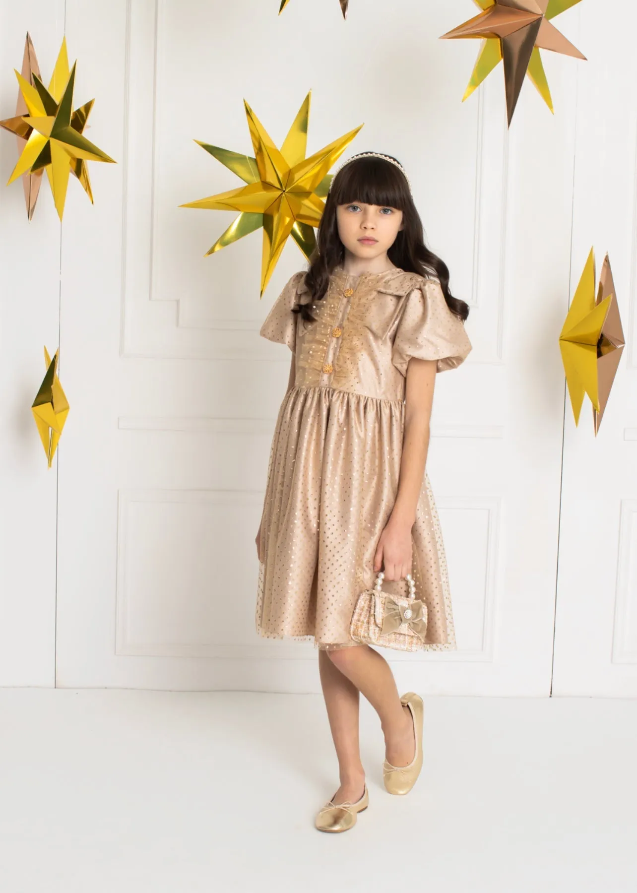 Beautiful Gold polkadot dress with ruffle and shoulder Bow details.